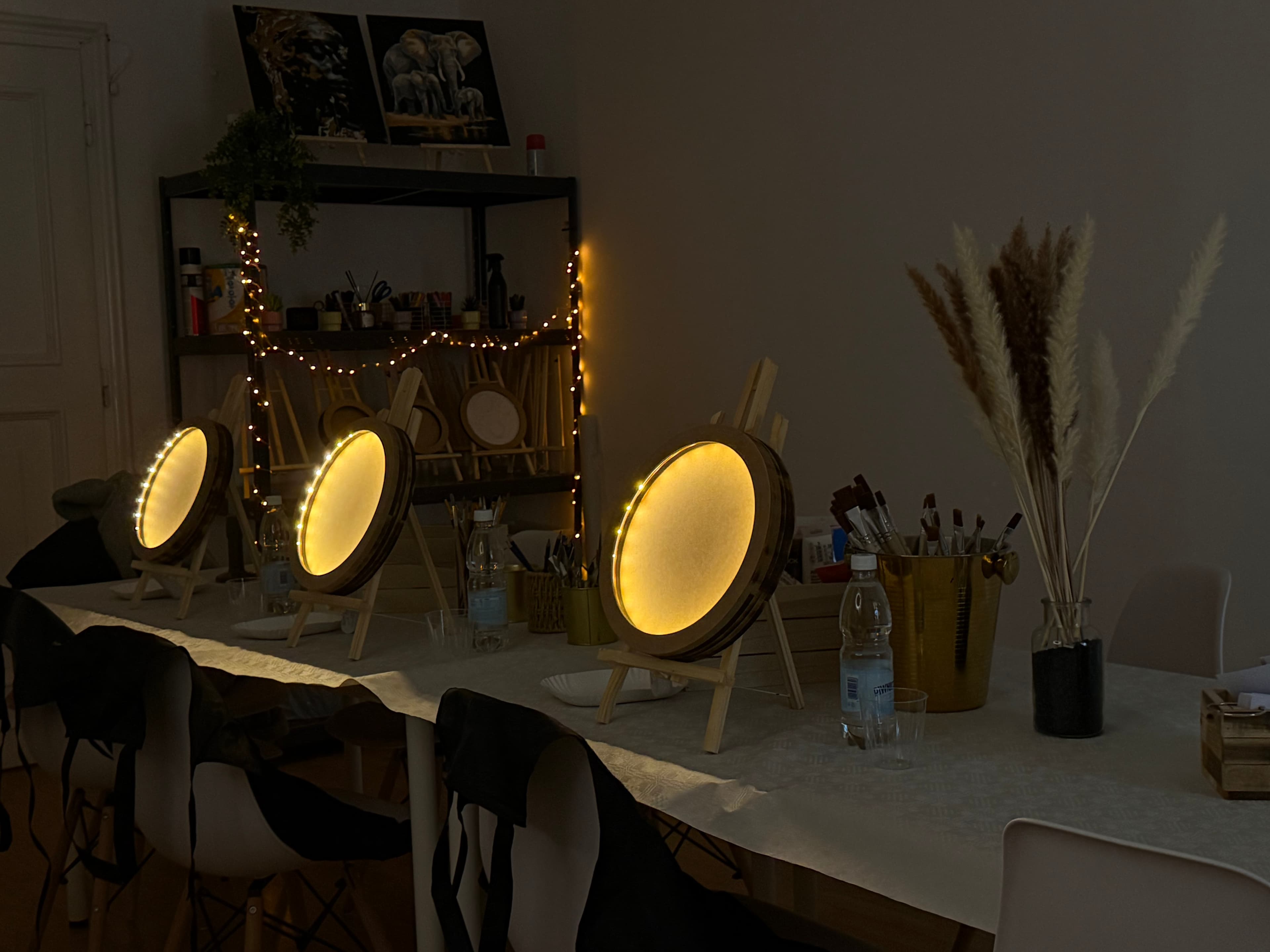 Moon workshop studio table with illuminated boards and art supplies